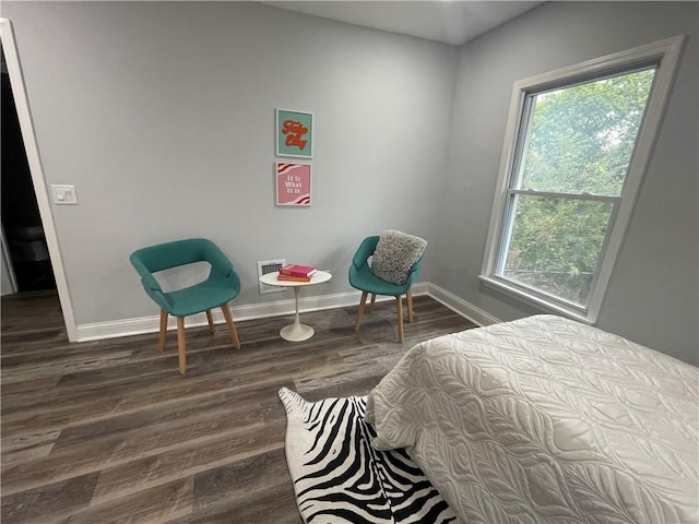 bedroom featuring dark hardwood / wood-style flooring