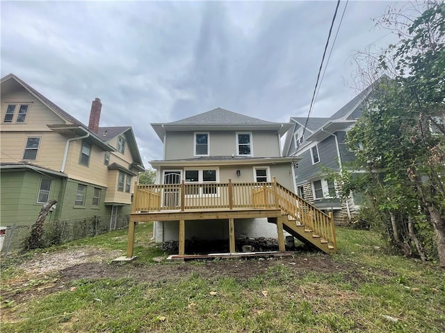 back of property featuring a deck