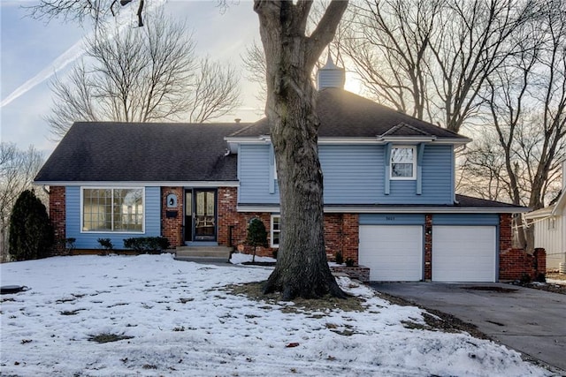 split level home featuring a garage