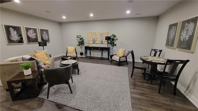 living room with dark hardwood / wood-style flooring