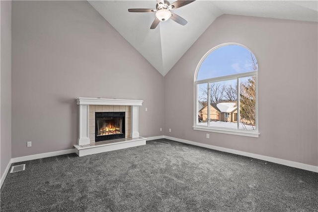 unfurnished living room with lofted ceiling, a fireplace, ceiling fan, and carpet flooring