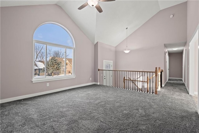 spare room featuring high vaulted ceiling, carpet floors, and ceiling fan