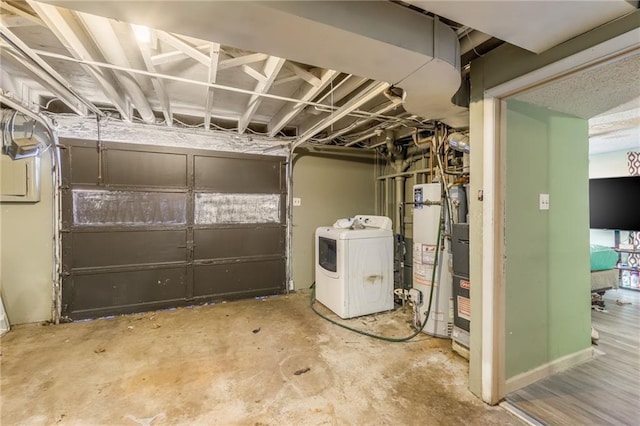 basement with washing machine and dryer and water heater