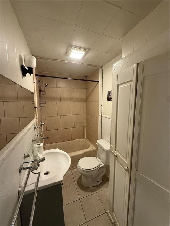 bathroom featuring tile patterned flooring, vanity, and toilet