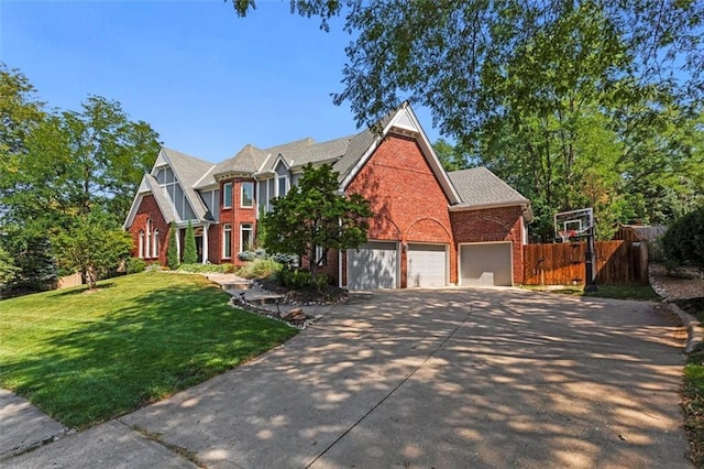 view of front of home featuring a garage and a front lawn