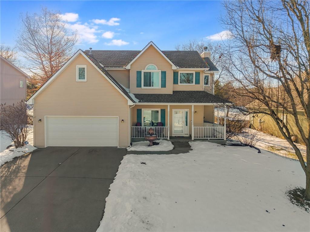 view of front of home with a garage and a porch