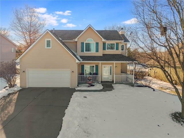 view of front of home with a garage and a porch