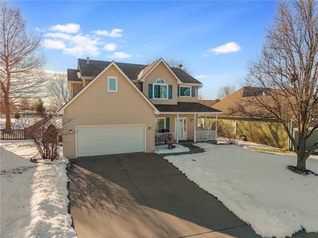 front of property featuring a porch and a garage