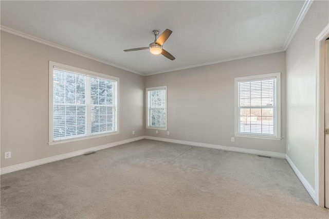 unfurnished room featuring light carpet, ceiling fan, and ornamental molding