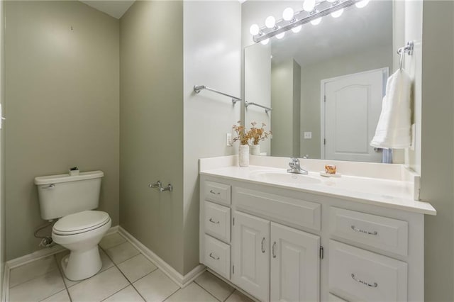 bathroom featuring toilet, vanity, and tile patterned floors