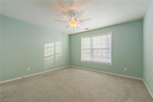 carpeted empty room with ceiling fan