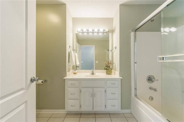 bathroom featuring combined bath / shower with glass door, tile patterned flooring, and vanity