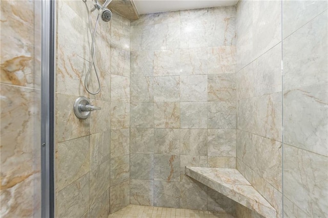 bathroom featuring a tile shower