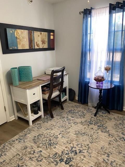 office area featuring dark wood-type flooring