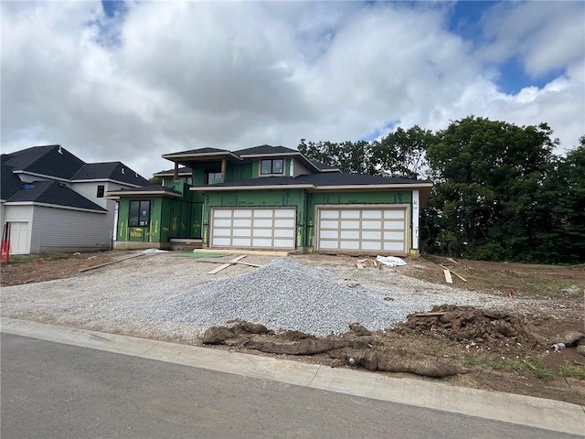 16900 Parkhill St, Overland Park, KS 66221 - view of front of home with driveway and board and batten siding