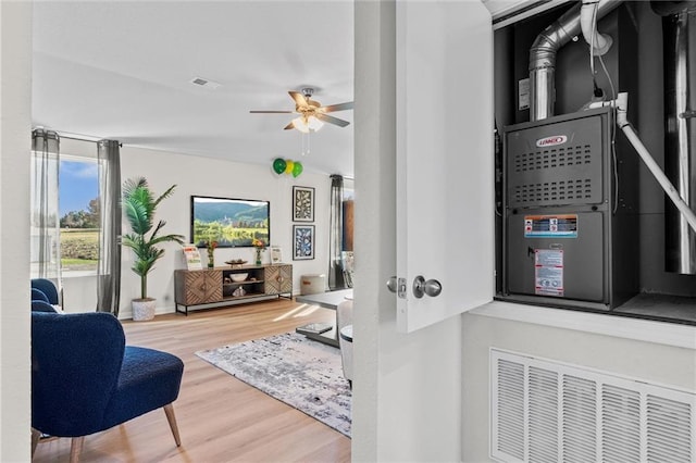 interior space with ceiling fan and hardwood / wood-style floors