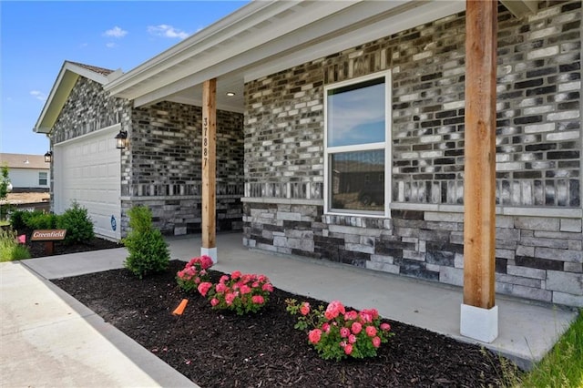 37887 W 207th Ter, Edgerton, KS 66021 - view of property exterior featuring a porch and a garage