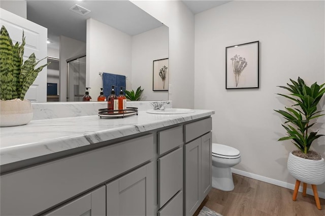 37767 W 207th Ter, Edgerton, KS 66021 - bathroom with vanity, wood finished floors, and an enclosed shower