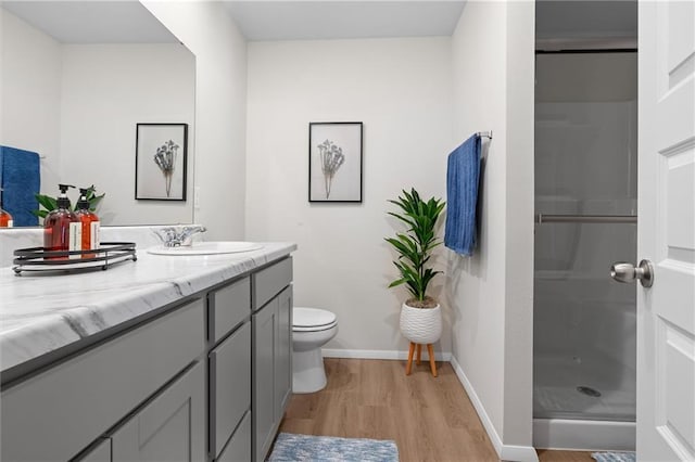 37767 W 207th Ter, Edgerton, KS 66021 - bathroom with wood finished floors, vanity, and a walk in shower