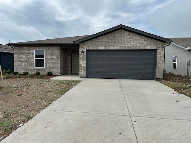 37767 W 207th Ter, Edgerton, KS 66021 - single story home featuring driveway, brick siding, and an attached garage
