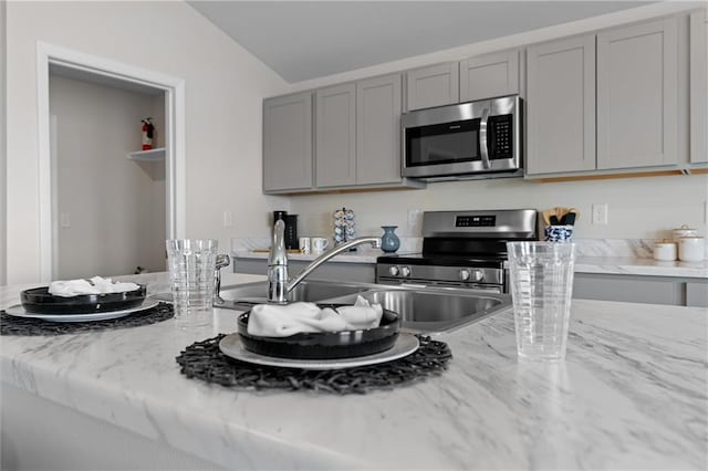 37767 W 207th Ter, Edgerton, KS 66021 - kitchen with stainless steel appliances, gray cabinetry, and light stone countertops