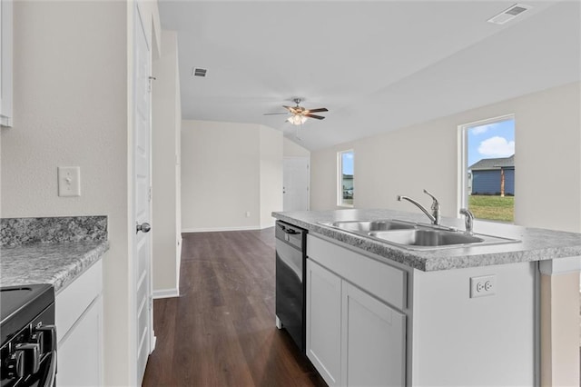 kitchen featuring ceiling fan, a center island with sink, stainless steel dishwasher, sink, and white cabinetry