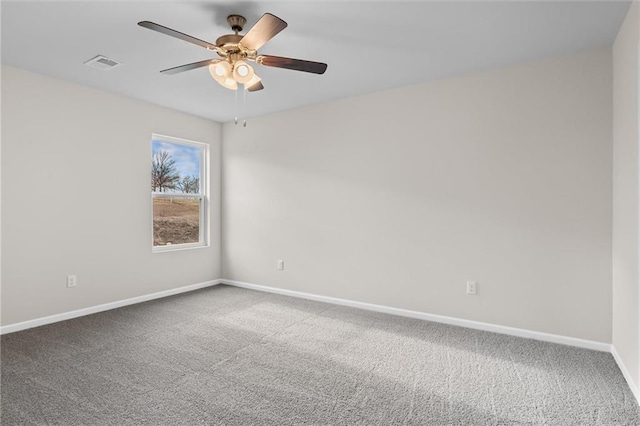 empty room featuring ceiling fan and carpet flooring