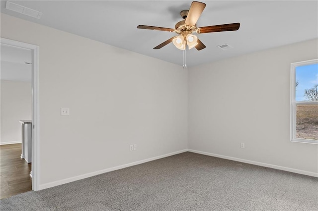 empty room featuring ceiling fan and carpet flooring