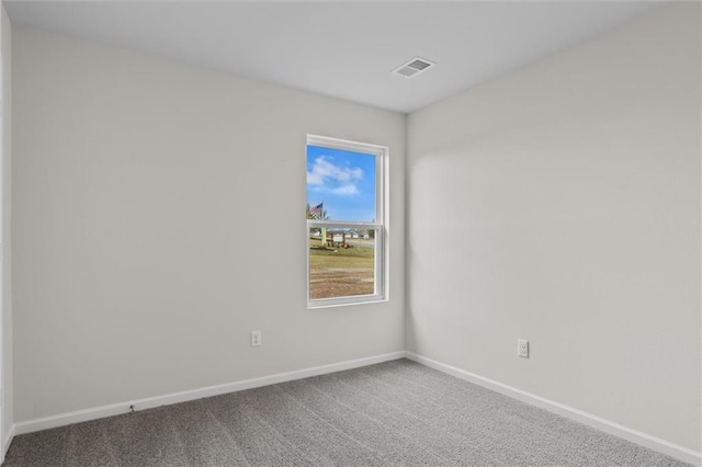 unfurnished room featuring carpet