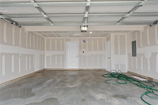 garage featuring electric panel and a garage door opener