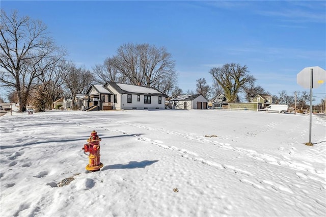 snowy yard with a storage unit