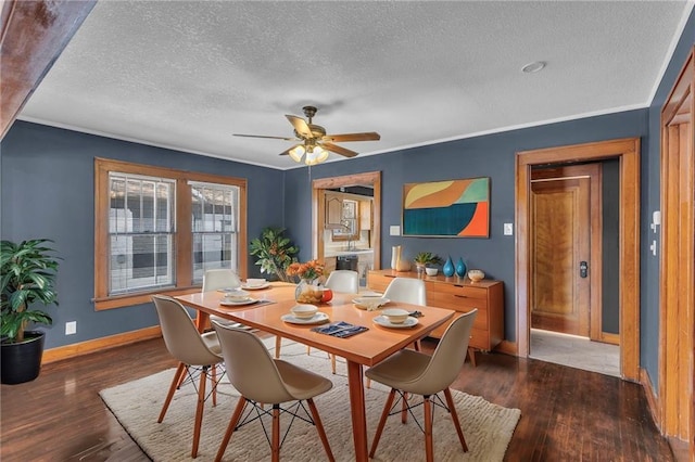 dining room featuring ceiling fan, dark wood-type flooring, and crown molding