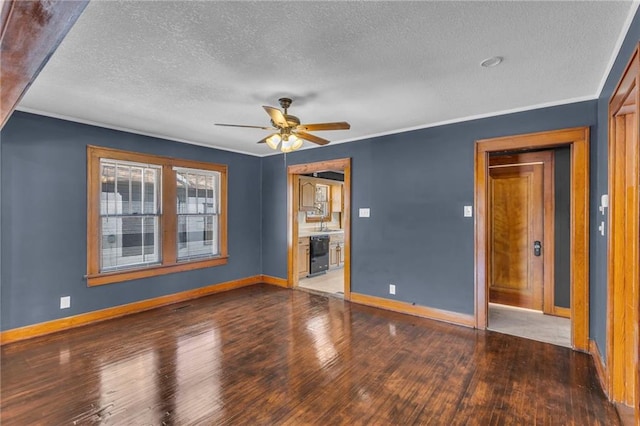 empty room featuring ceiling fan, crown molding, hardwood / wood-style floors, and sink