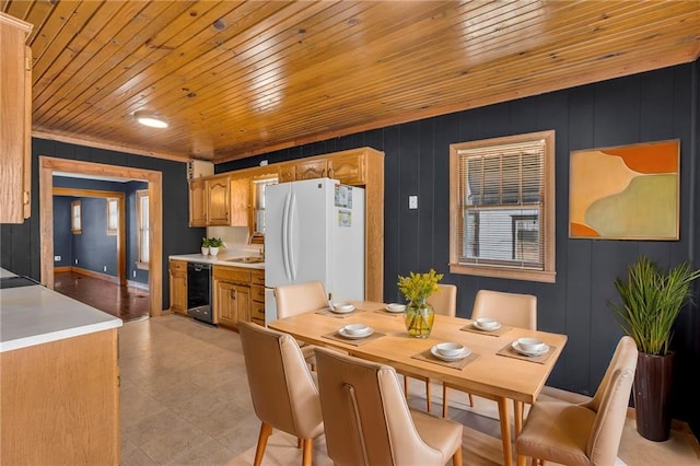 dining area featuring sink and beverage cooler