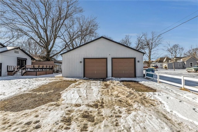 view of snow covered garage