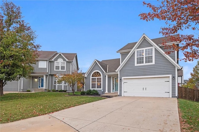 view of front of home featuring a front lawn and a garage