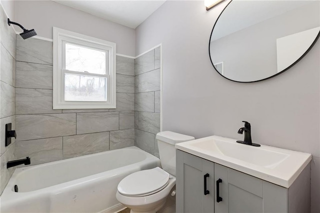 full bathroom featuring vanity, toilet, and tiled shower / bath