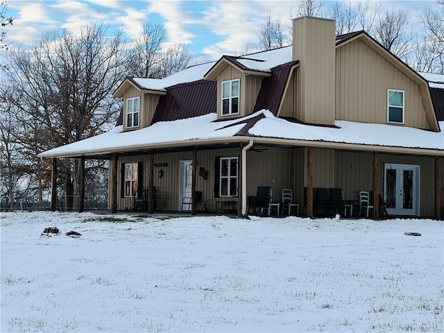 view of front of house featuring covered porch and french doors