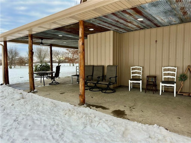 snow covered patio with ceiling fan