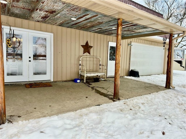 view of patio / terrace with a garage and french doors