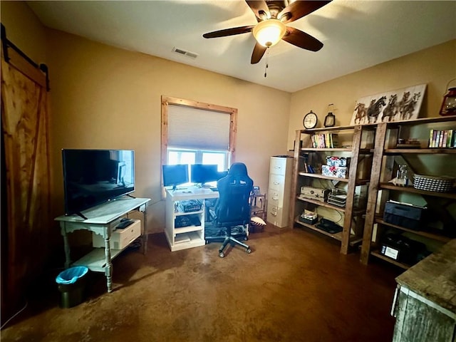 office area featuring ceiling fan and a barn door