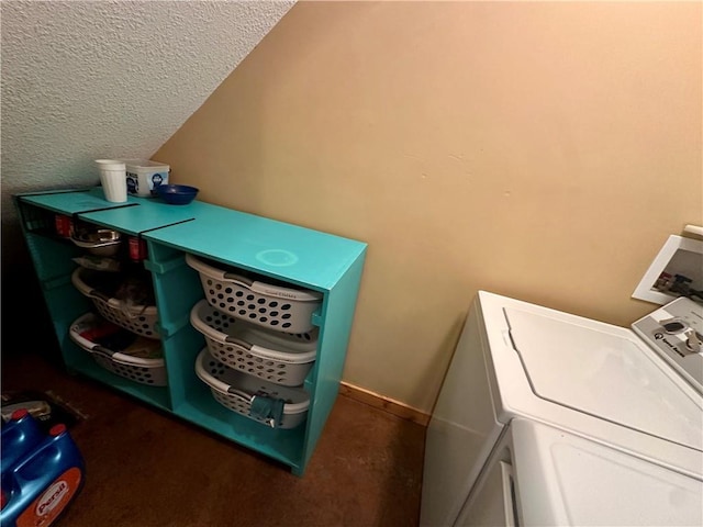 washroom featuring a textured ceiling and separate washer and dryer