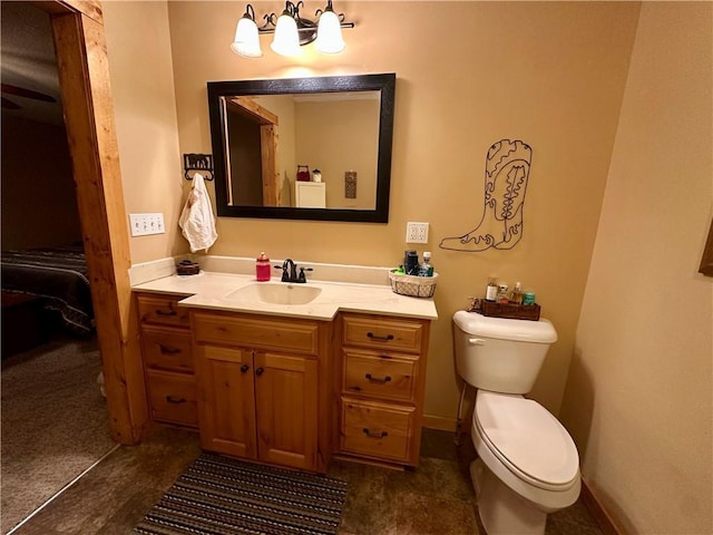 bathroom featuring toilet and vanity