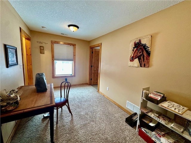 office featuring a textured ceiling and carpet floors