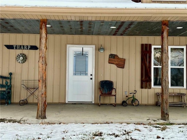 view of snow covered property entrance