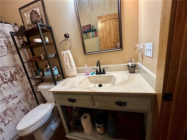 bathroom featuring vanity and toilet