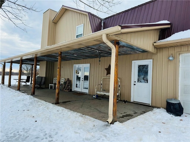 view of snow covered property entrance