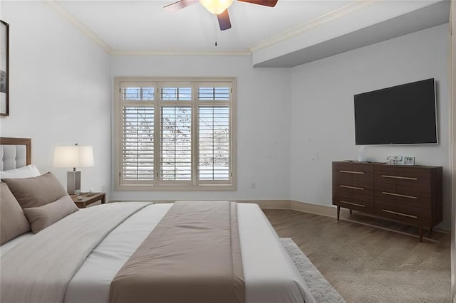 bedroom featuring ceiling fan and crown molding