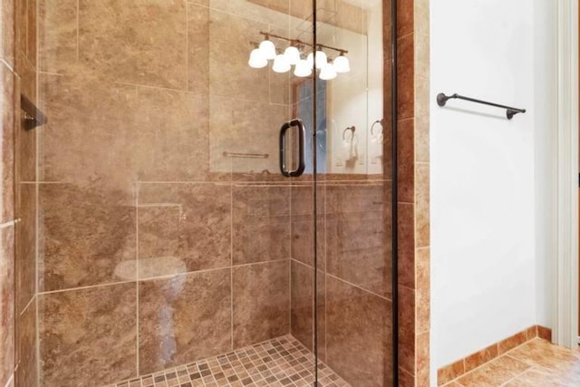 bathroom with a shower with shower door