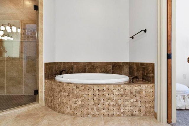 bathroom with tile patterned flooring and independent shower and bath